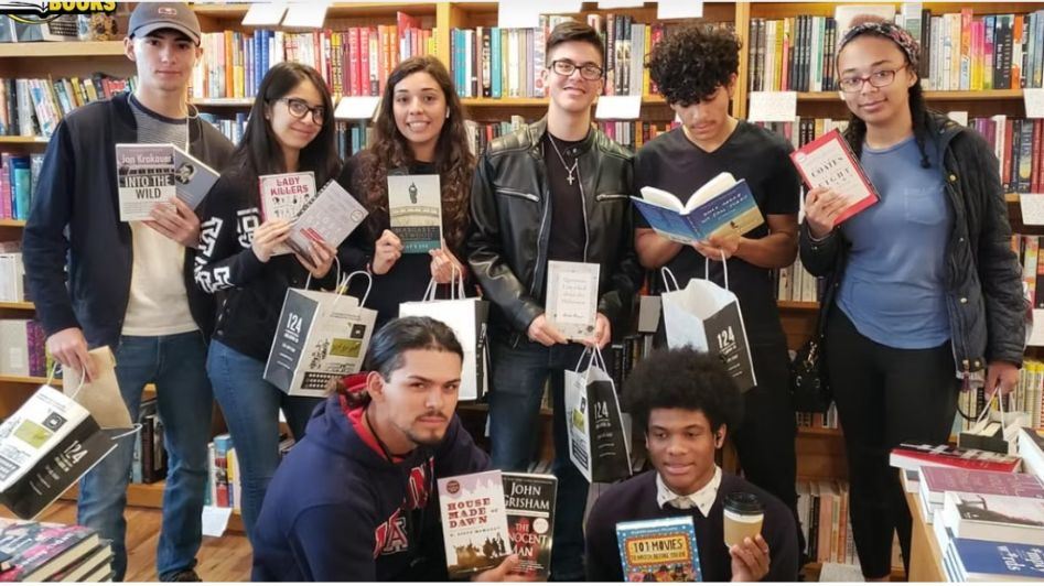  Western students learning a love for reading and receiving a free book at Literati Bookstore